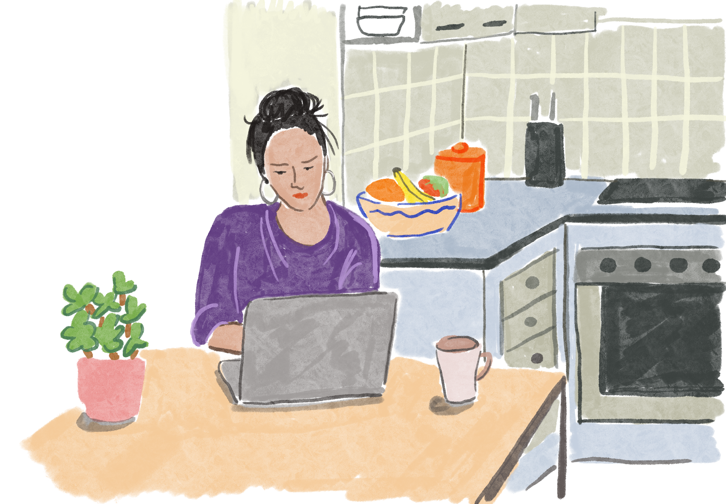 Woman using a computer in kitchen